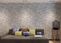 O papel de parede de vista real cinzento não tecido do tijolo gravou 3D o efeito, tamanho de 0.53*10M